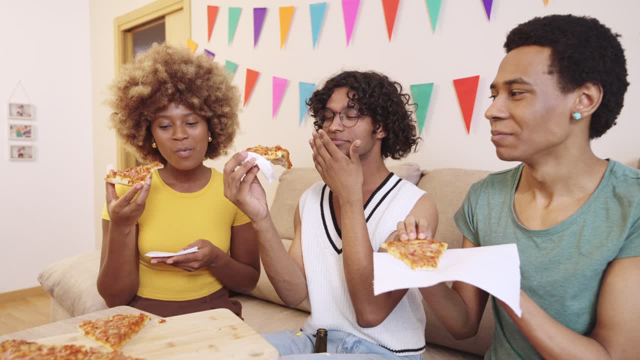 Friends celebrating with pizza