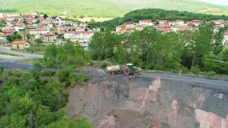 Tractor-watering-the-soil-with-a-water-tank