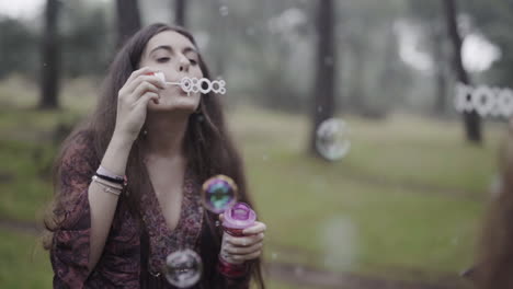 stopping time blowing soap magic bubbles by a spanish white girl