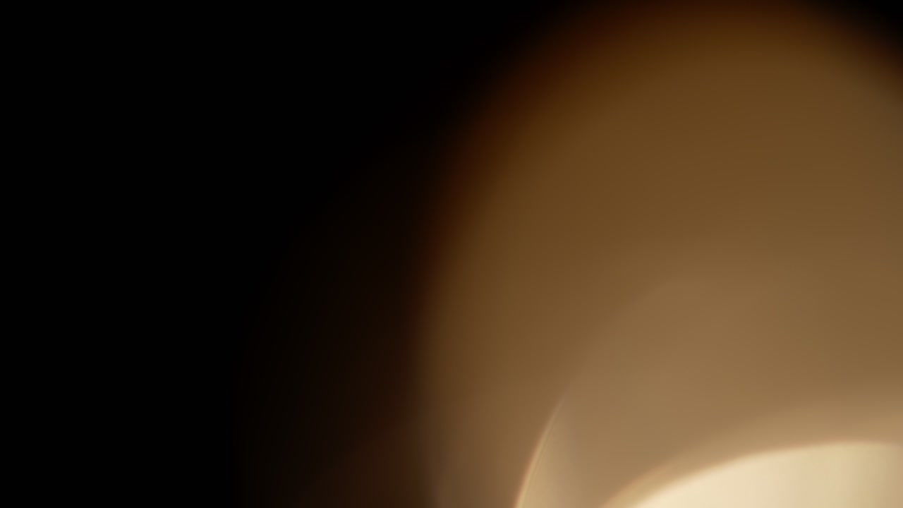 Multicolored light leaks 4k footage on black background. Stylizing video, transitions. Bokeh effect