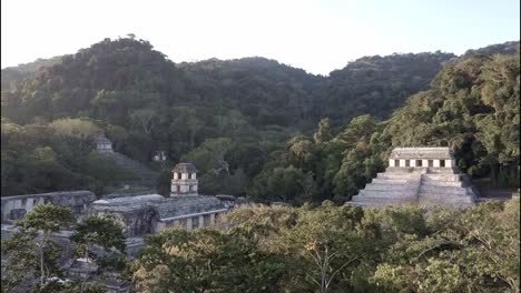 an aerial view over palenque mayan pyramids in mexico