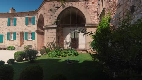 slow rotating shot of a beautiful antique garden within chateau de pouzilhac