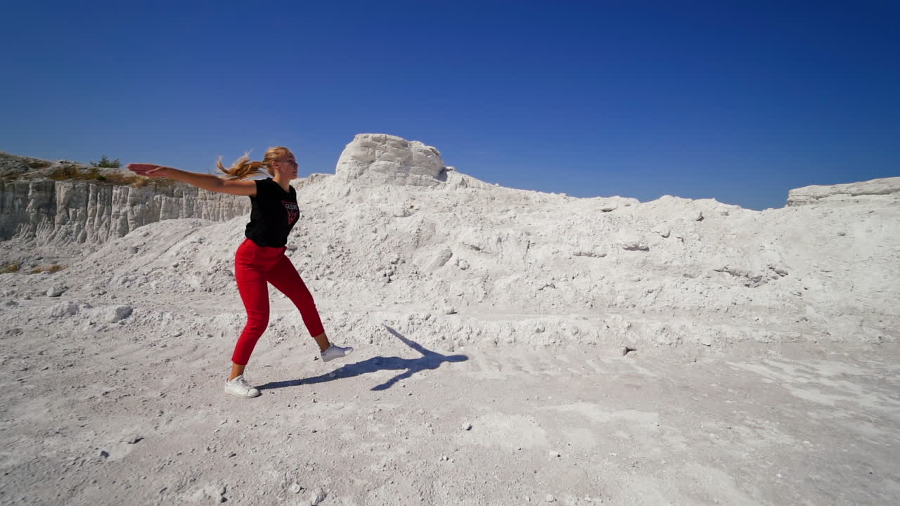 Woman Dancing in a Quarry Landscape