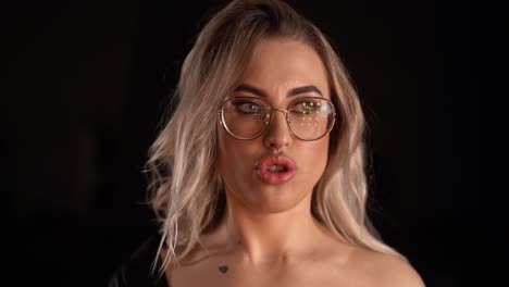 portrait of a sexy girl with glasses looking at the camera