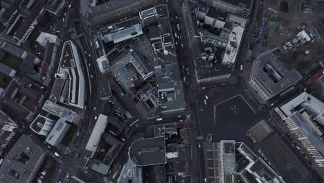 Aerial-birds-eye-overhead-top-down-view-of-buildings-in-city.-Tilt-up-reveal-of-modern-skyscrapers-in-financial-borough.-Frankfurt-am-Main,-Germany