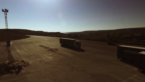 aerial shot of highway in spain, cars and trucks driving by