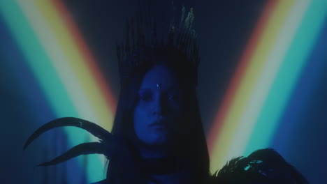 woman in gothic crown and feather dress