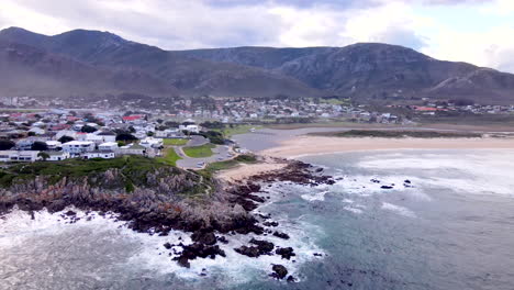 scenic kleinmond coastal town with blue flag beach and mountain backdrop