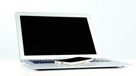 Close-up-of-laptop-and-mobile-phone