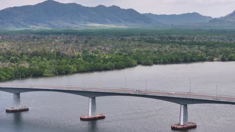 aerial view of transportation vehicles across the siri lanta bridge in koh lanta, krabi, thailand.