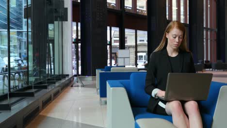 businesswoman using laptop in office 4k