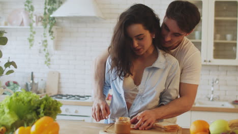 happy couple preparing breakfast in the morning