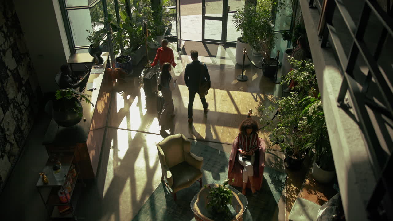 Lobby scene with people and plants