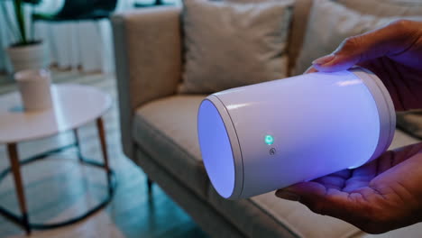person holding a smart device in a living room