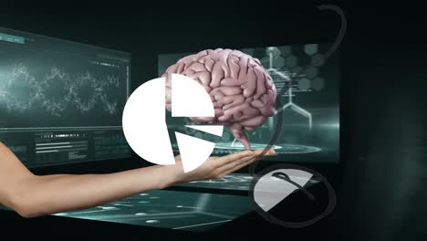 Animation-of-hand-holding-digital-brain-over-data-processing-on-black-background