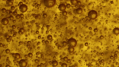 slomo-macro-gaseous-translucent-brownish-bubbles-rise-in