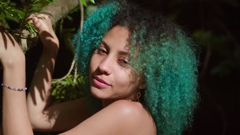 Pretty-face-close-up-of-a-young-girl-with-green-hair-and-smile