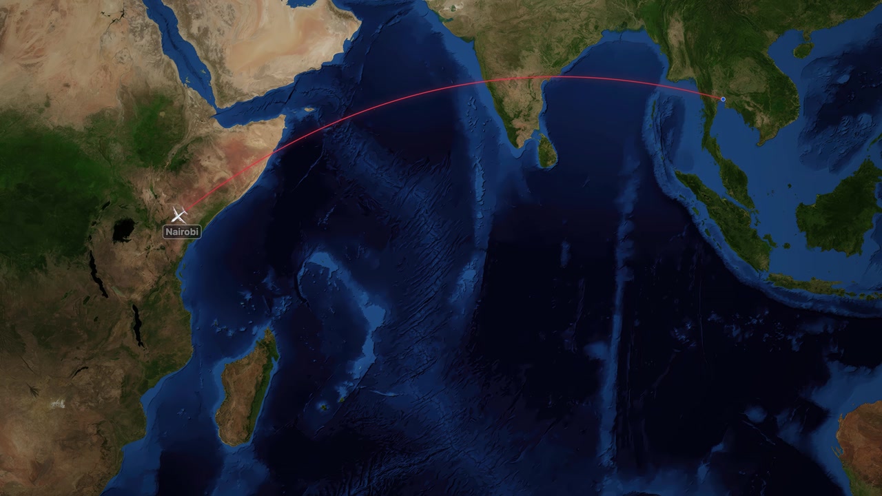 Animated satellite map tracks an airplane icon flying from Bangkok to Nairobi across the ocean