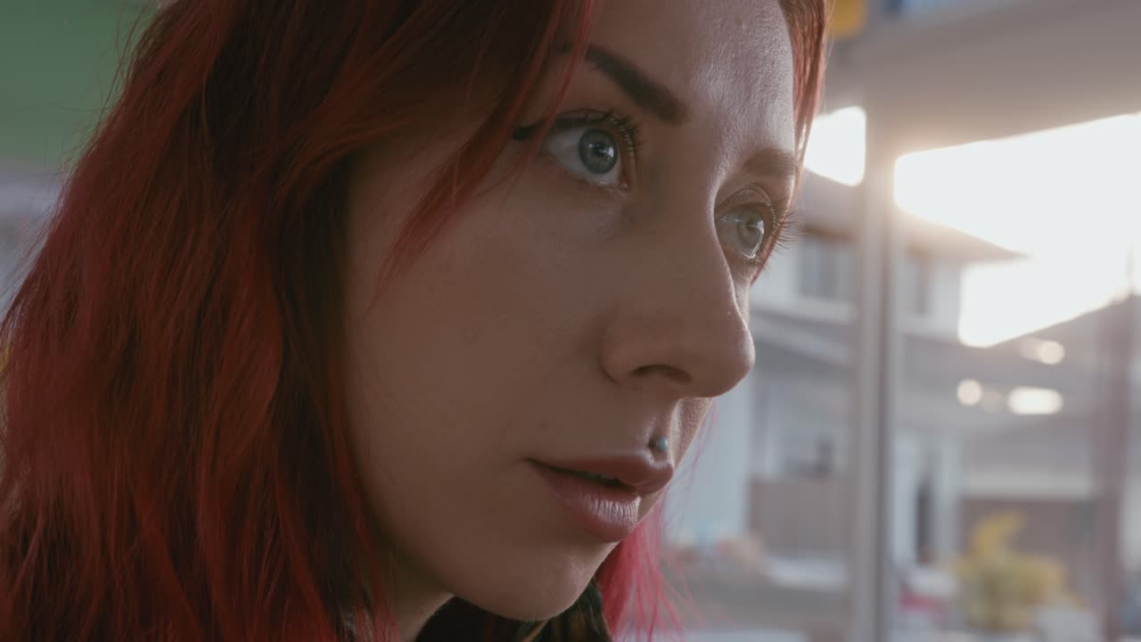 Close-up portrait of a woman with red hair