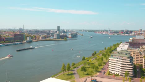 Busy-Waterways-Of-Ij-River-In-The-Cityscape-Of-Amsterdam,-The-Netherlands