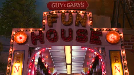 a fun house at a carnival at night