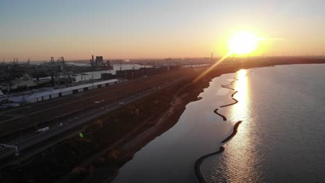 sunlight illuminates on brielse meer next to the maasvakte harbour in rotterdam