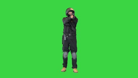 police tactical unit aiming with a hand gun on a green screen, chroma key