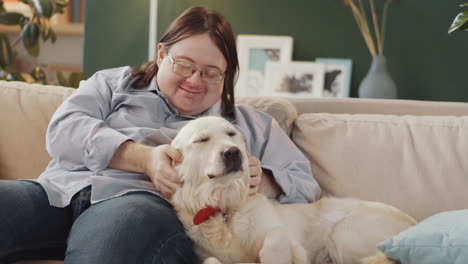 man and dog on a couch