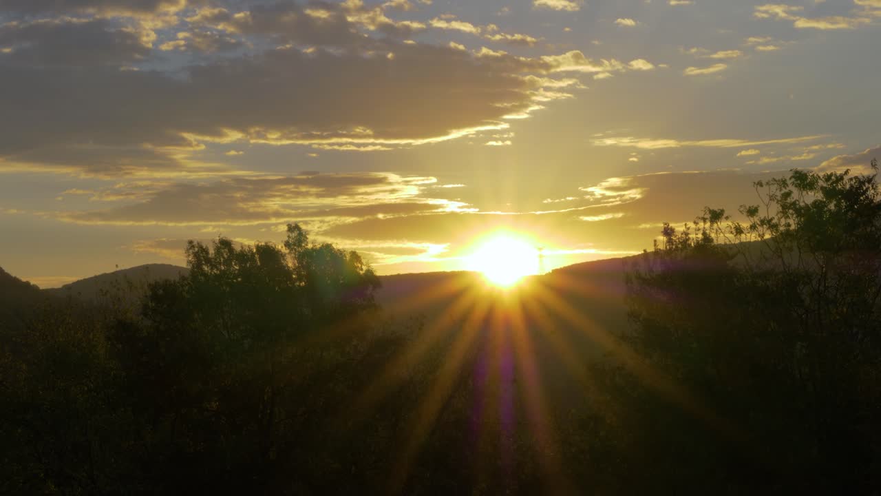 Sunrise Over Provencal Countryside With Hills And Forest in slowmotion it's golden hour