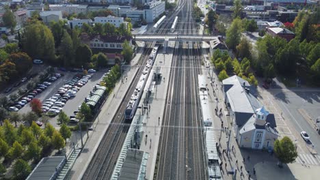 Passenger-train-departs-Kerava-Rail-Station-heading-to-Helsinki,-FIN