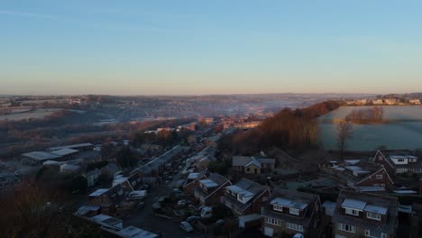 A-drone's-eye-view-captures-Dewsbury-Moore-Council-estate's-fame,-a-typical-UK-urban-council-owned-housing-development-with-red-brick-terraced-homes-and-the-industrial-Yorkshire