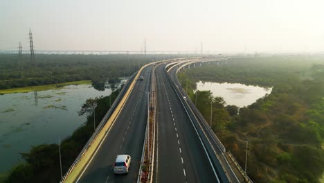 hazy day on india highway to mumbai, city smog in nature infrastructure