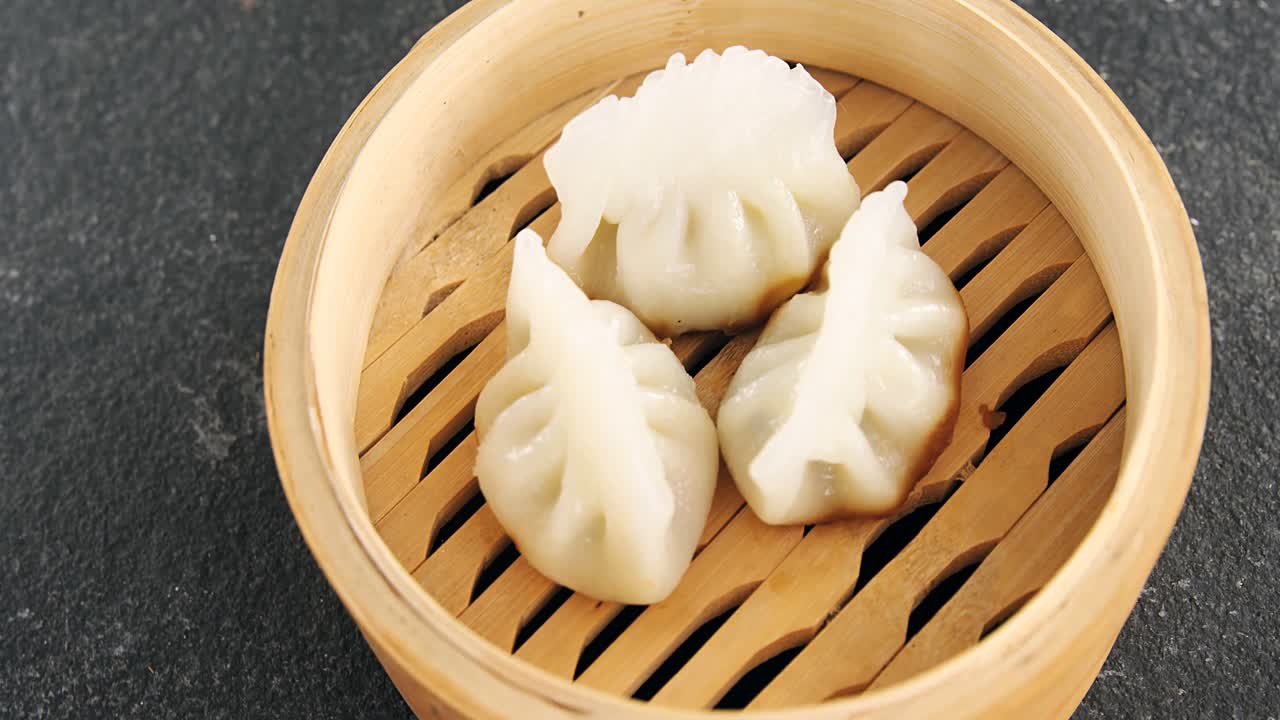 Steamed dumplings in bamboo steamer