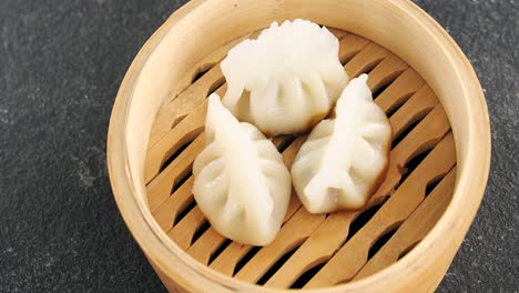 steamed dumplings in bamboo steamer