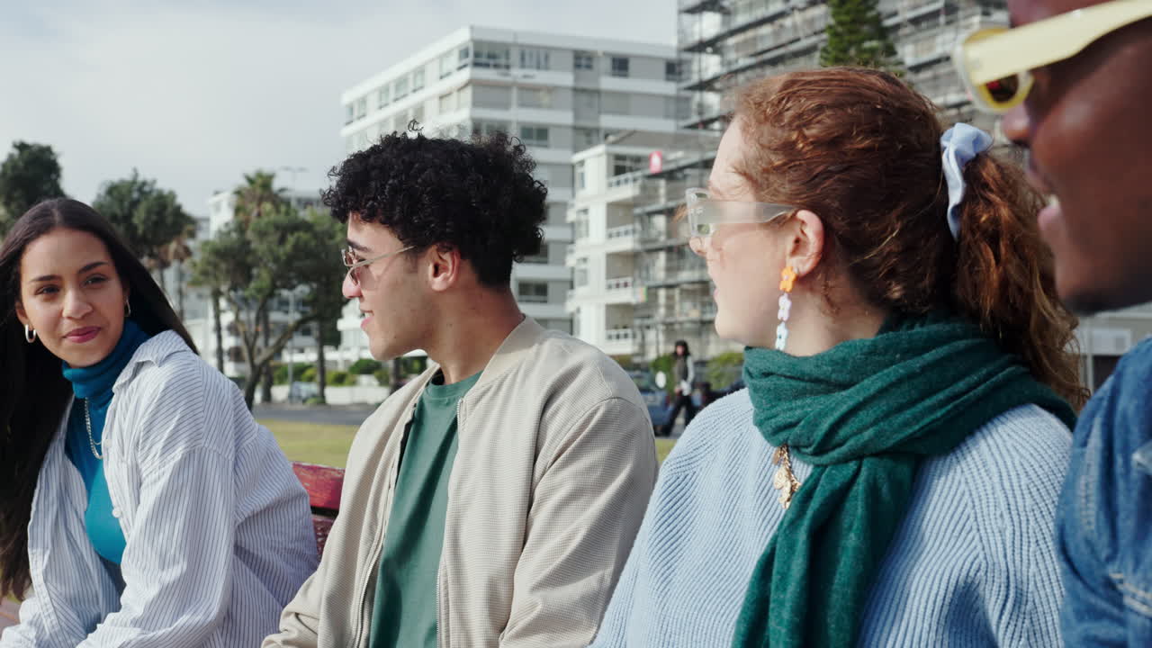 Group of friends talking on a bench