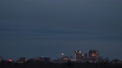 day to night time lapse of winnipeg skyline in april.