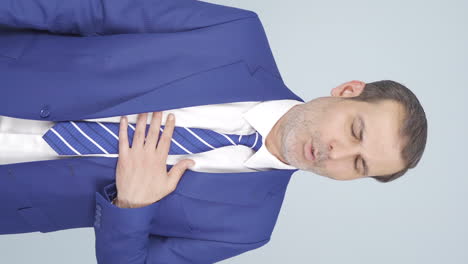 Vertical-video-of-Businessman-experiencing-shortness-of-breath.