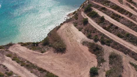Aerial-drone-video-from-eastern-Malta,-Marsaxlokk-area,-Il-Hofra-l-Kbira-bay
