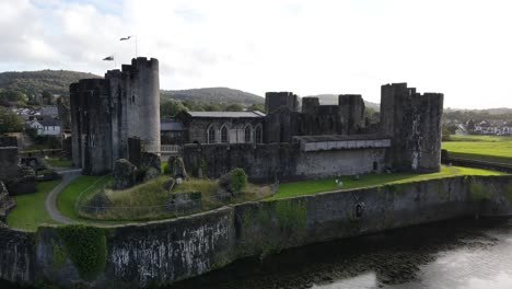 medieval fortress surrounded by moat, caerphilly castle, wales