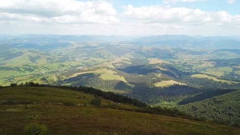 a man photographs a mountain landscape while hiking in the mountains a man photographs a mountain landscape while hiking in the mountains nature photography