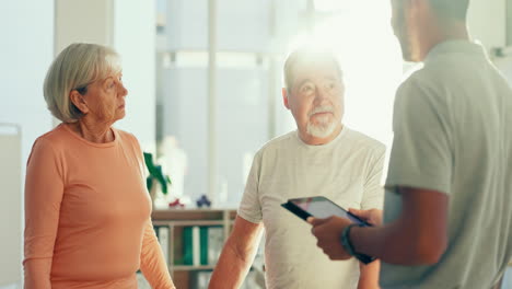 Physiotherapy,-tablet-and-man-with-senior-couple