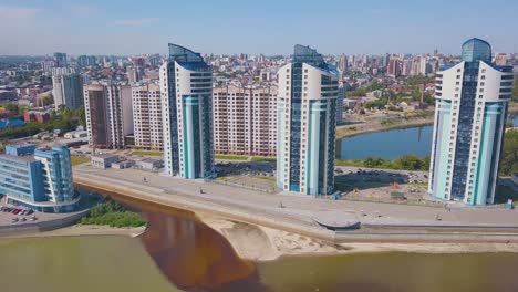 newlywed-couple-on-viewpoint-near-river-in-city-aerial-view