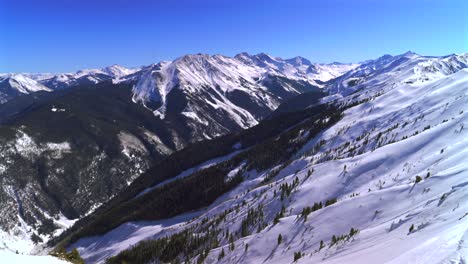 aspen highlands bowl panorama ski resort backcountry skiing snowboarding high alpine steep terrain colorado landscape maroon bells capital peak wilderness blue sky winter deep snow sunny pan right