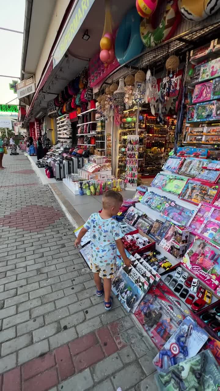 Child looking at toys in a souvenir shop