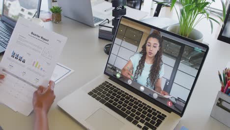 African-american-businesswoman-using-laptop-for-video-call-with-caucasian-business-colleague