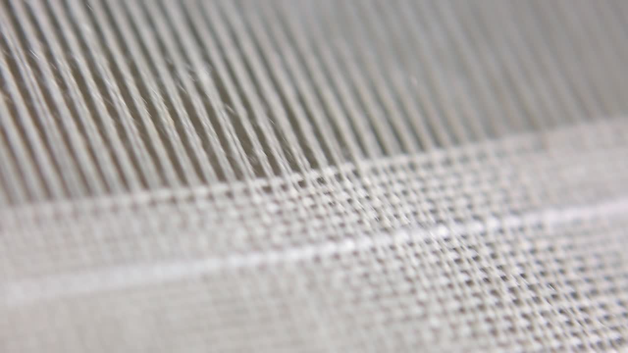 industria textil, primer plano del proceso de fabricación de telares a mano