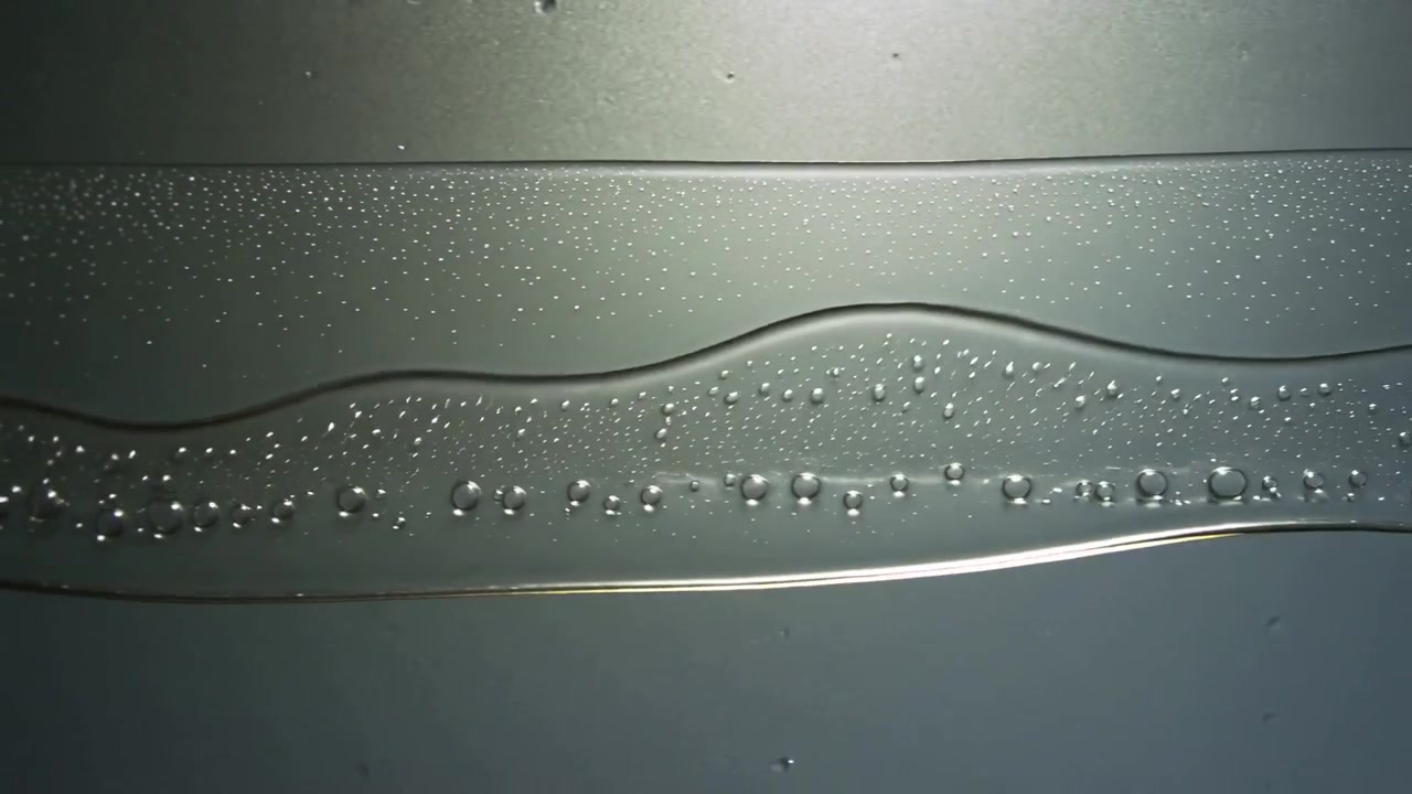 Clear Liquid Flowing Down a Smooth Surface