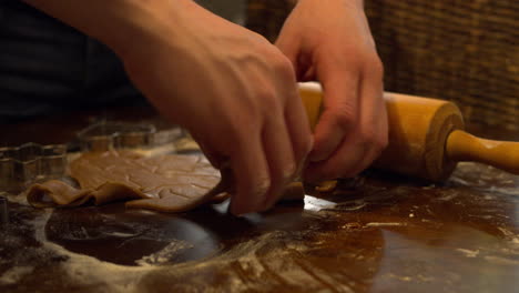 Removing-the-cut-out-gingerbread-dough-from-the-table