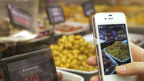 Taking-picture-of-olives-in-the-shop