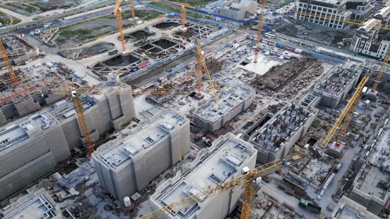 Aerial close up construction site yellow crane building residential area in smart city